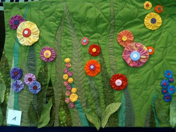 Green background quilt at Somers Quilt Show 2012