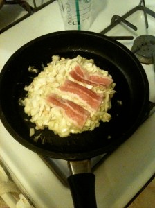 Okonomiyaki with bacon in pan